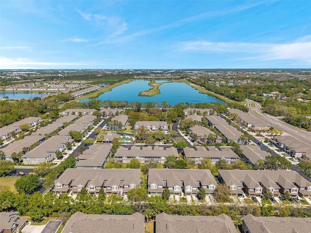 drone / aerial view with a residential view and a water view