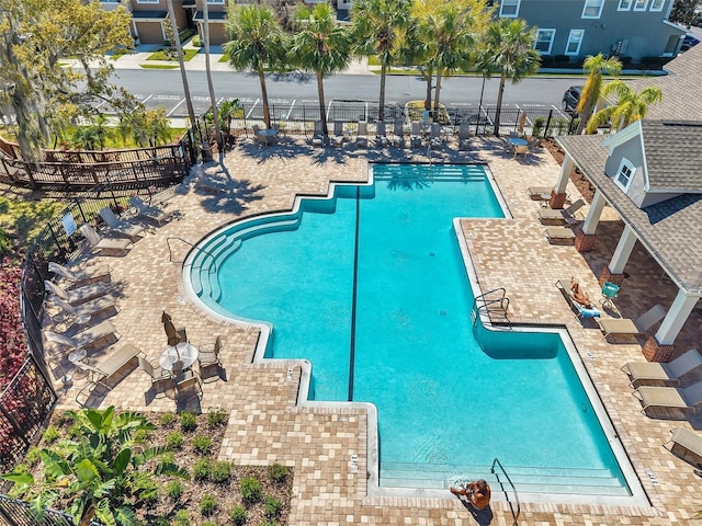 pool featuring a patio and fence