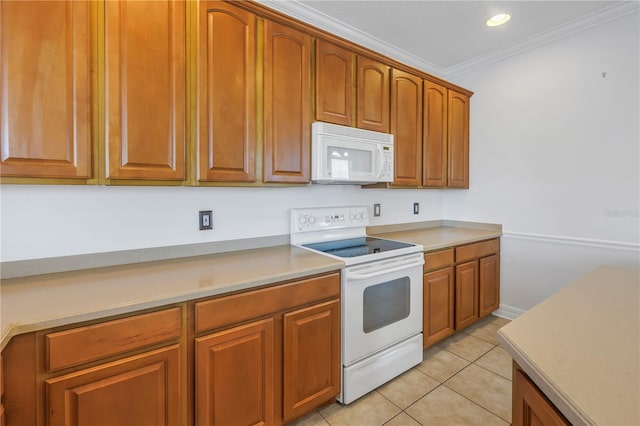 kitchen featuring light countertops, ornamental molding, light tile patterned floors, brown cabinets, and white appliances