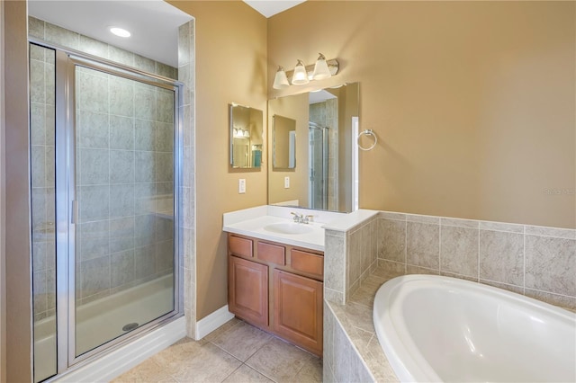 full bathroom with tile patterned flooring, a shower stall, a bath, and vanity