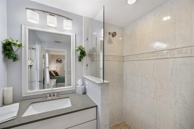 bathroom featuring ensuite bath, vanity, and walk in shower