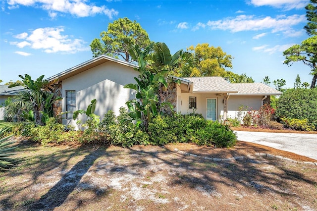 single story home with stucco siding