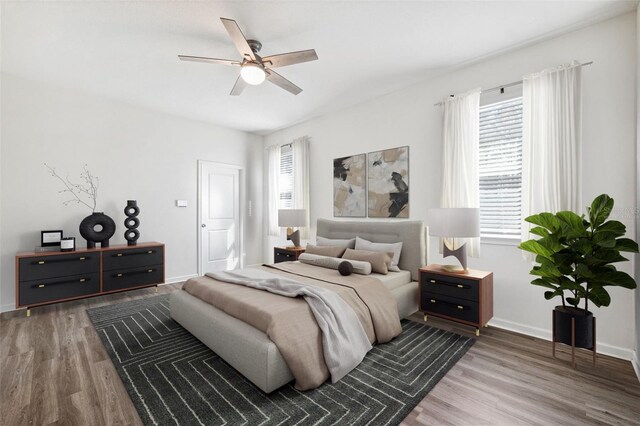 13001 Satin Lily Dr, Riverview, FL 33579 - bedroom with wood finished floors, baseboards, and a ceiling fan