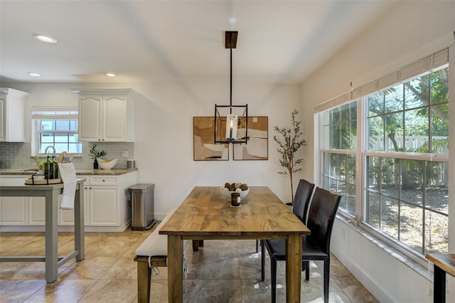 dining area with recessed lighting and baseboards