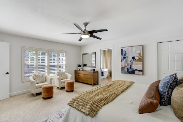 carpeted bedroom with a ceiling fan and baseboards