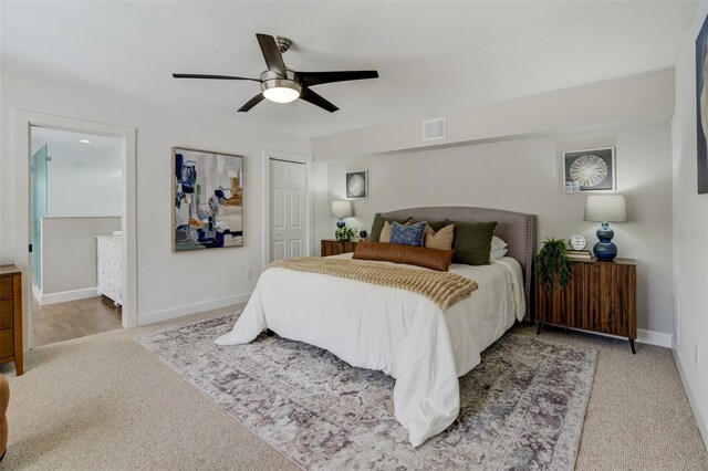 bedroom featuring visible vents, baseboards, carpet floors, and a closet