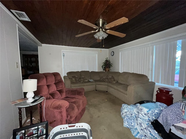 living room with a ceiling fan, carpet, wood ceiling, and visible vents