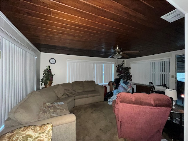 living area featuring carpet floors, wood ceiling, and ceiling fan