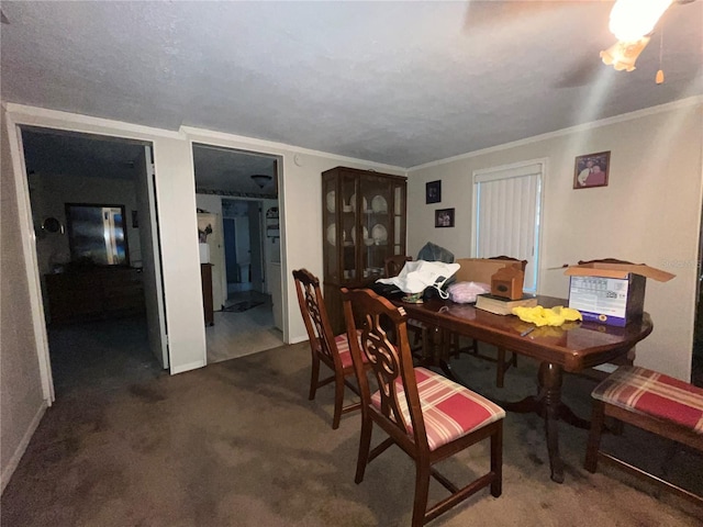 dining room featuring baseboards, carpet, and ornamental molding