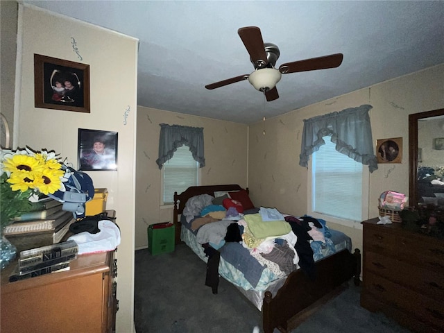 carpeted bedroom with ceiling fan