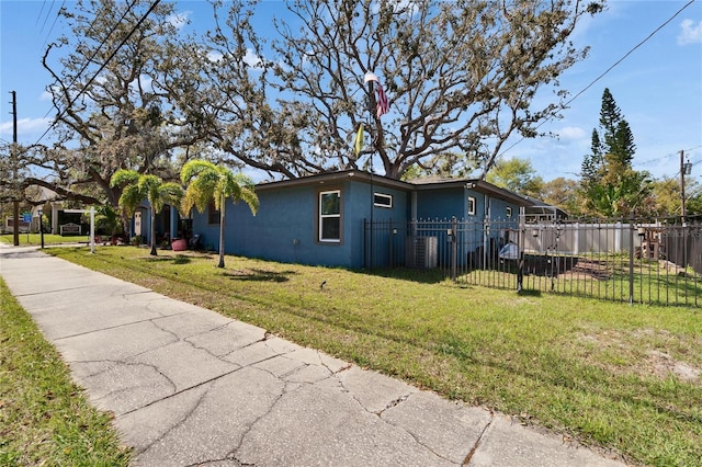 view of property exterior with stucco siding, a yard, central AC, and fence