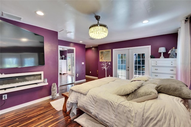 bedroom with visible vents, wood finished floors, recessed lighting, french doors, and baseboards