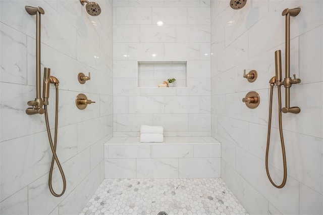 full bathroom with tiled shower