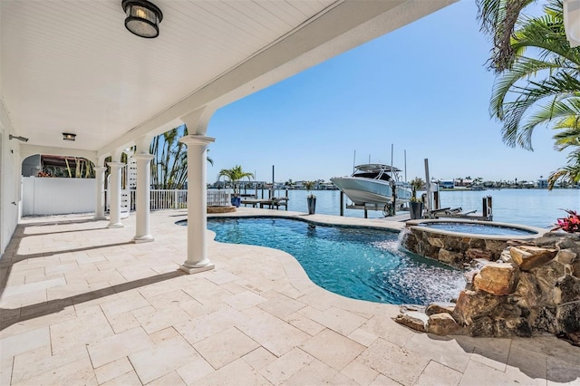 view of swimming pool with a water view, boat lift, a dock, and a patio area