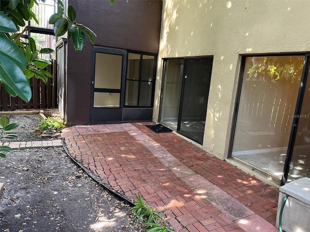 view of patio / terrace featuring fence