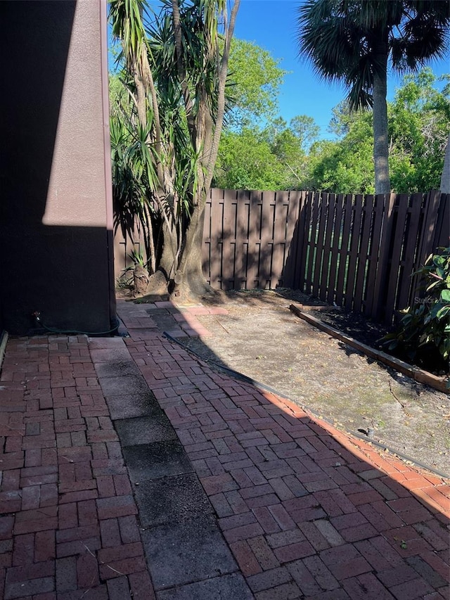 730 S Village Dr N Unit 101, Saint Petersburg, FL 33716 - view of patio / terrace with fence