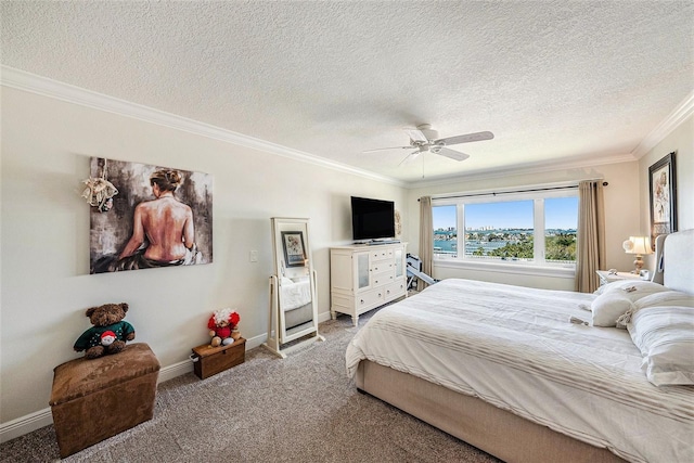 bedroom with ornamental molding, a ceiling fan, a textured ceiling, carpet flooring, and baseboards