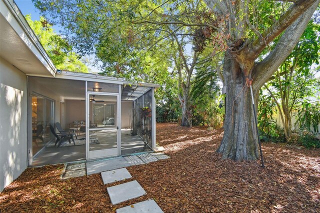 view of yard featuring a sunroom