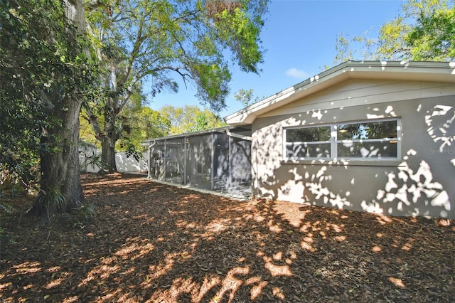 view of yard featuring a sunroom