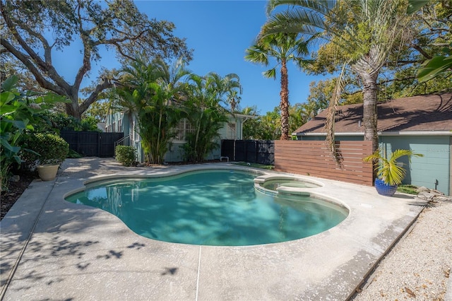 view of pool with a patio, fence, and a pool with connected hot tub