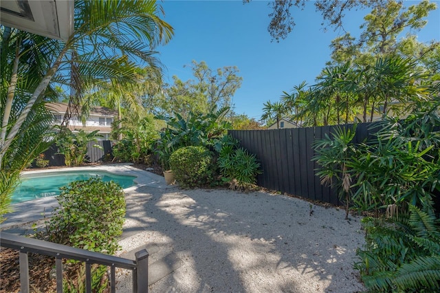 view of swimming pool with a patio, a fenced backyard, and a fenced in pool