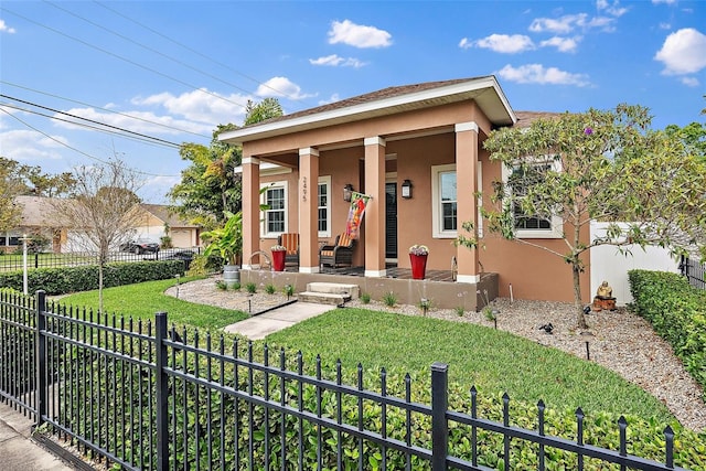 view of front of property featuring covered porch, stucco siding, fence private yard, and a front yard