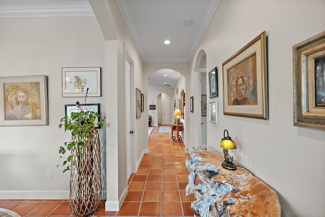 hallway featuring tile patterned floors, arched walkways, ornamental molding, and recessed lighting