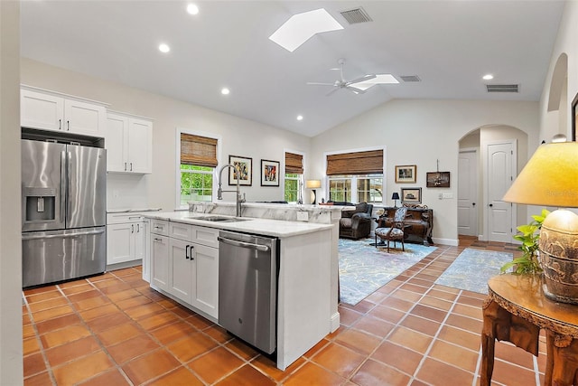 kitchen with white cabinets, visible vents, appliances with stainless steel finishes, and a sink