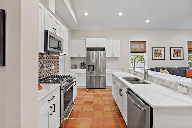 kitchen with decorative backsplash, recessed lighting, appliances with stainless steel finishes, and a sink