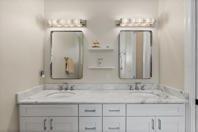 full bath featuring a sink and double vanity