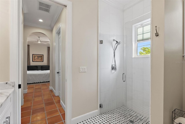 ensuite bathroom featuring visible vents, a shower stall, baseboards, ornamental molding, and tile patterned floors