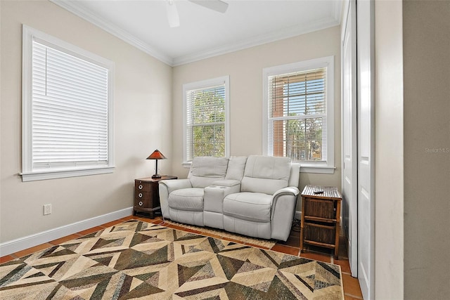 living area featuring baseboards, a ceiling fan, wood finished floors, and crown molding