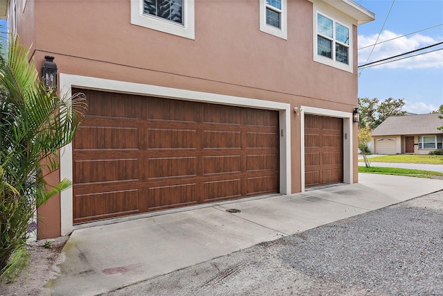 garage featuring driveway