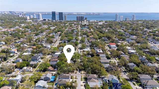 drone / aerial view featuring a residential view and a water view