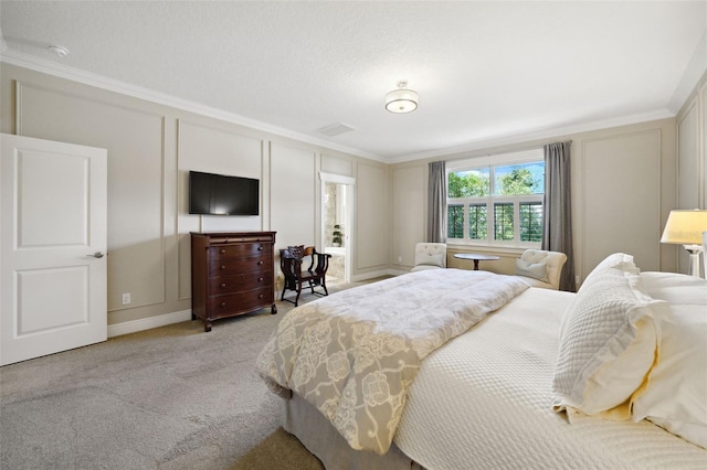 bedroom with carpet, ornamental molding, and a decorative wall