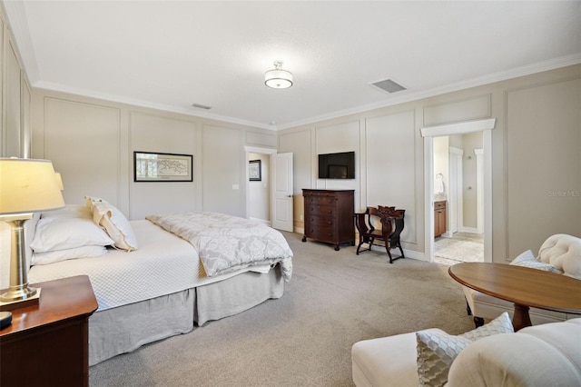 bedroom featuring light carpet, a decorative wall, visible vents, and ornamental molding