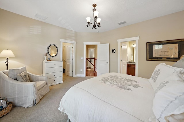 bedroom with a notable chandelier, visible vents, and light colored carpet