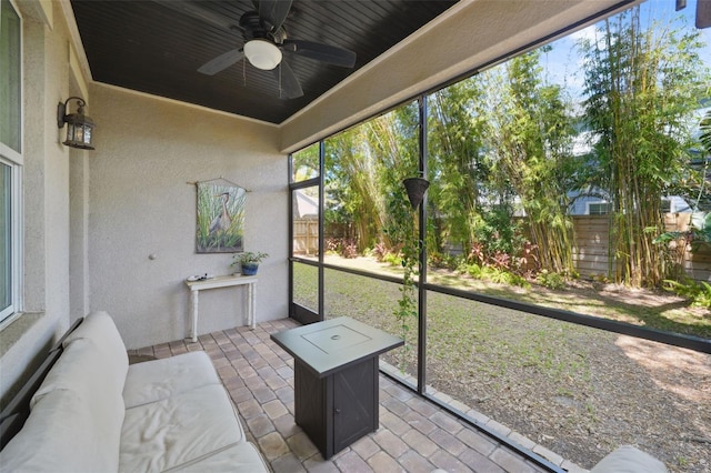 sunroom / solarium with ceiling fan