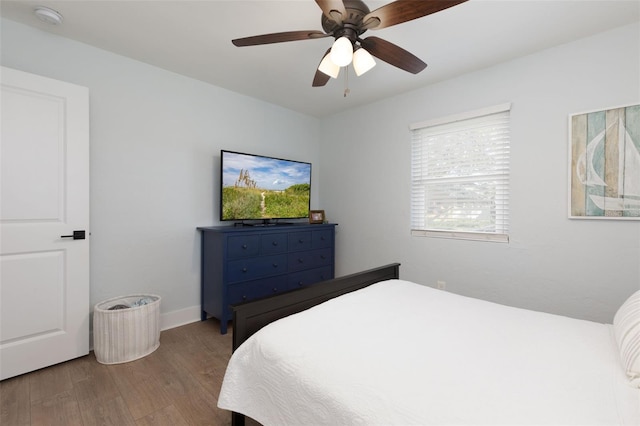 bedroom featuring wood finished floors and ceiling fan