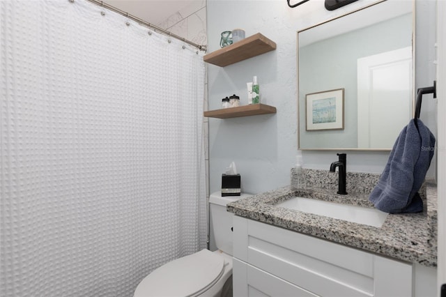 bathroom featuring curtained shower, toilet, and vanity