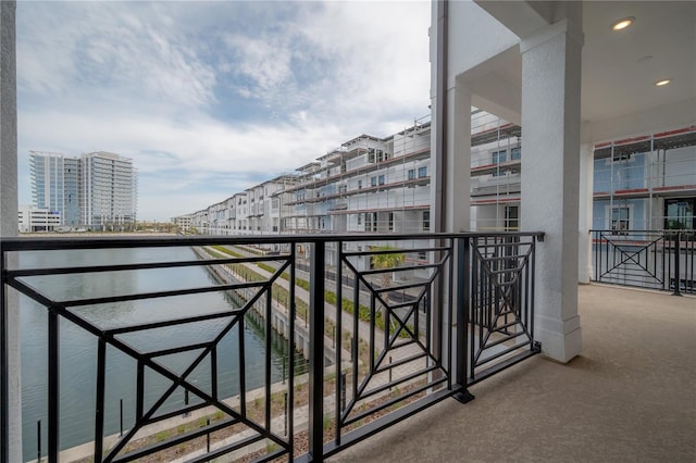 balcony with a city view and a water view