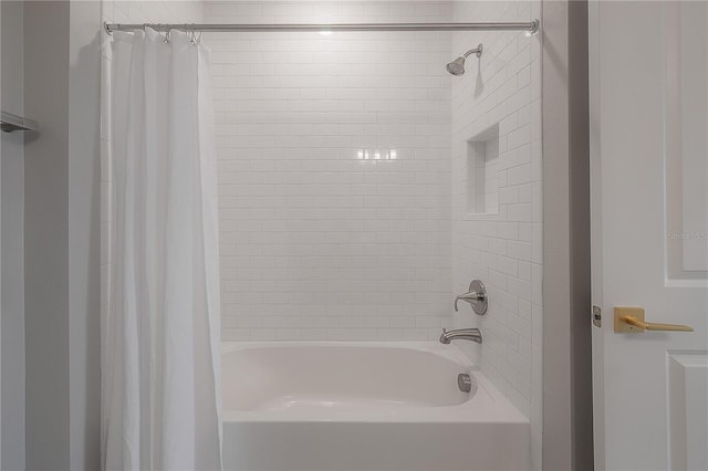 bathroom featuring shower / bathtub combination with curtain