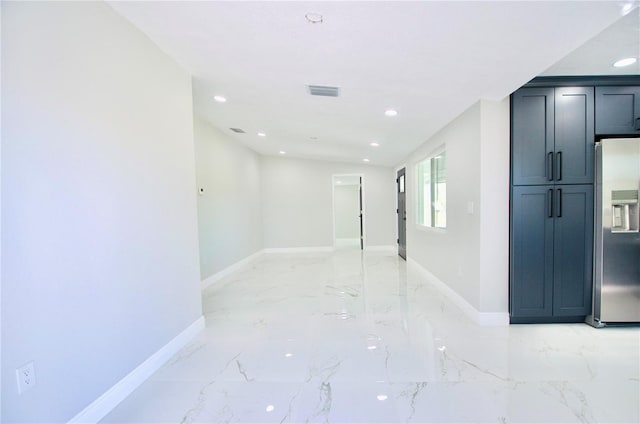 empty room with recessed lighting, visible vents, baseboards, and marble finish floor