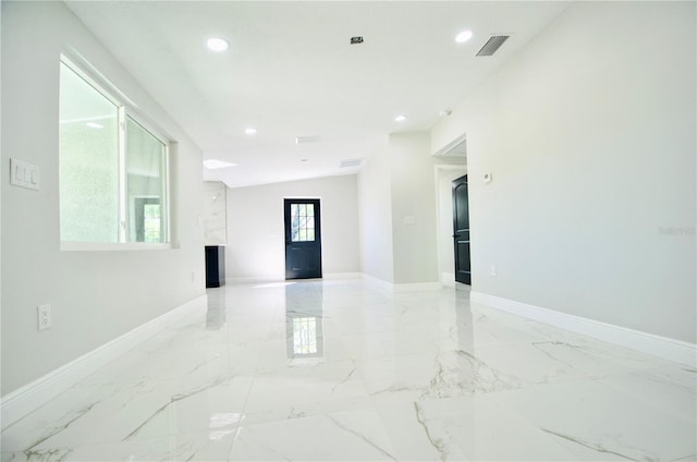 empty room with recessed lighting, visible vents, marble finish floor, and baseboards