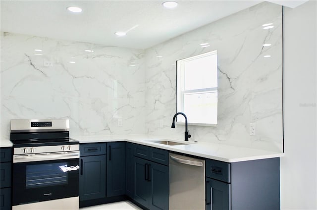 kitchen featuring a sink, appliances with stainless steel finishes, and recessed lighting