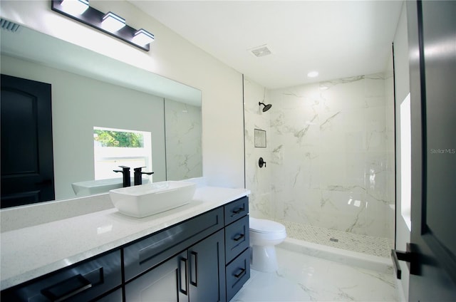 bathroom featuring vanity, visible vents, a marble finish shower, toilet, and marble finish floor