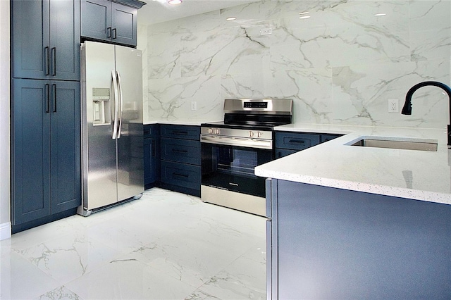 kitchen featuring a sink, light stone countertops, marble finish floor, and stainless steel appliances