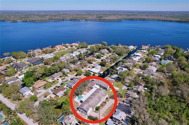 birds eye view of property featuring a residential view and a water view