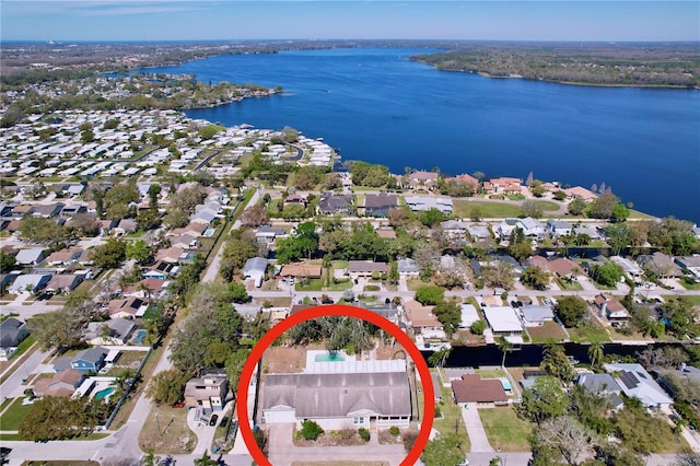 birds eye view of property featuring a water view and a residential view