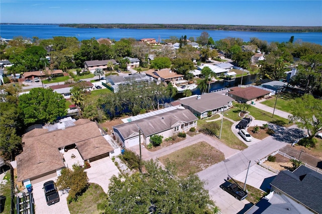 birds eye view of property with a residential view and a water view